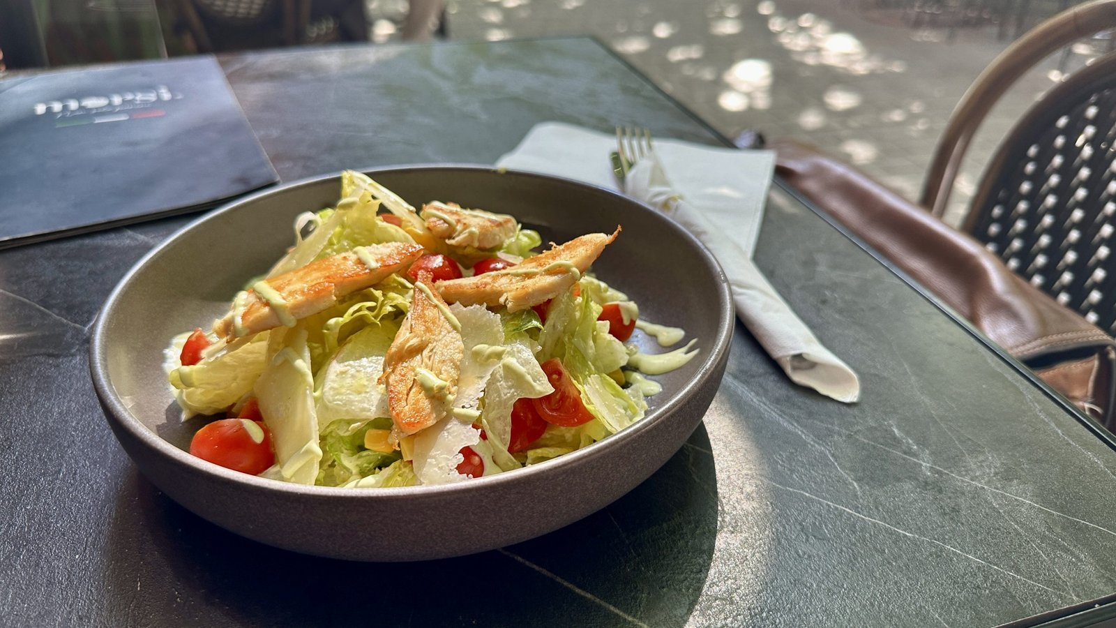 Photo of Caesar Salad with
Iceberg lettuce, grilled chicken breast, Grana Padano cheese, cherry tomatoes, croutons, Caesar dressing
