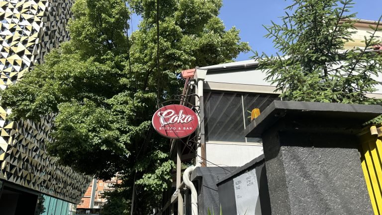 Photo of the small sign outside of the Coko restaurant