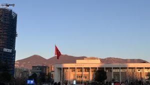 Photo in Tirana's Square, with the mountains in the background
