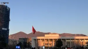 Photo in Tirana's Square, with the mountains in the background