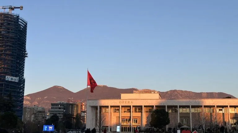 Photo in Tirana's Square, with the mountains in the background