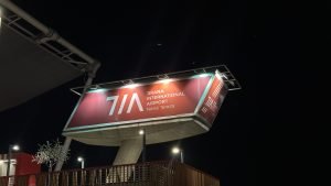 TIA Airport Sign from outside, at night.