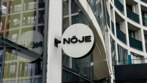Noje Sign, in front of shop